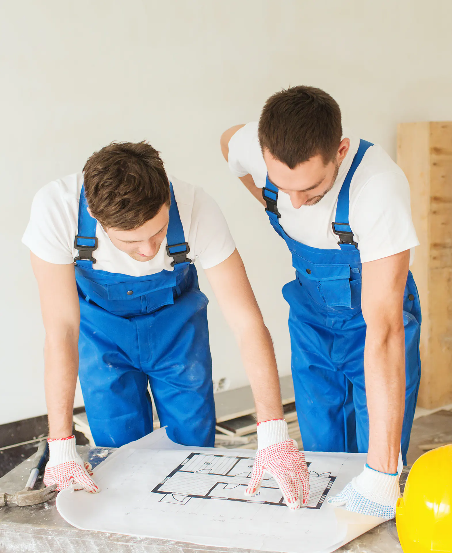 two men looking at a floor plan